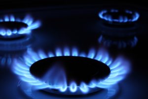 blue flames of a gas stove